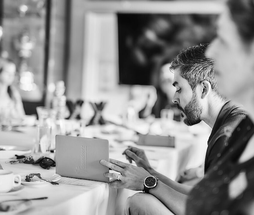 Joe D'Souza reviewing client documentation